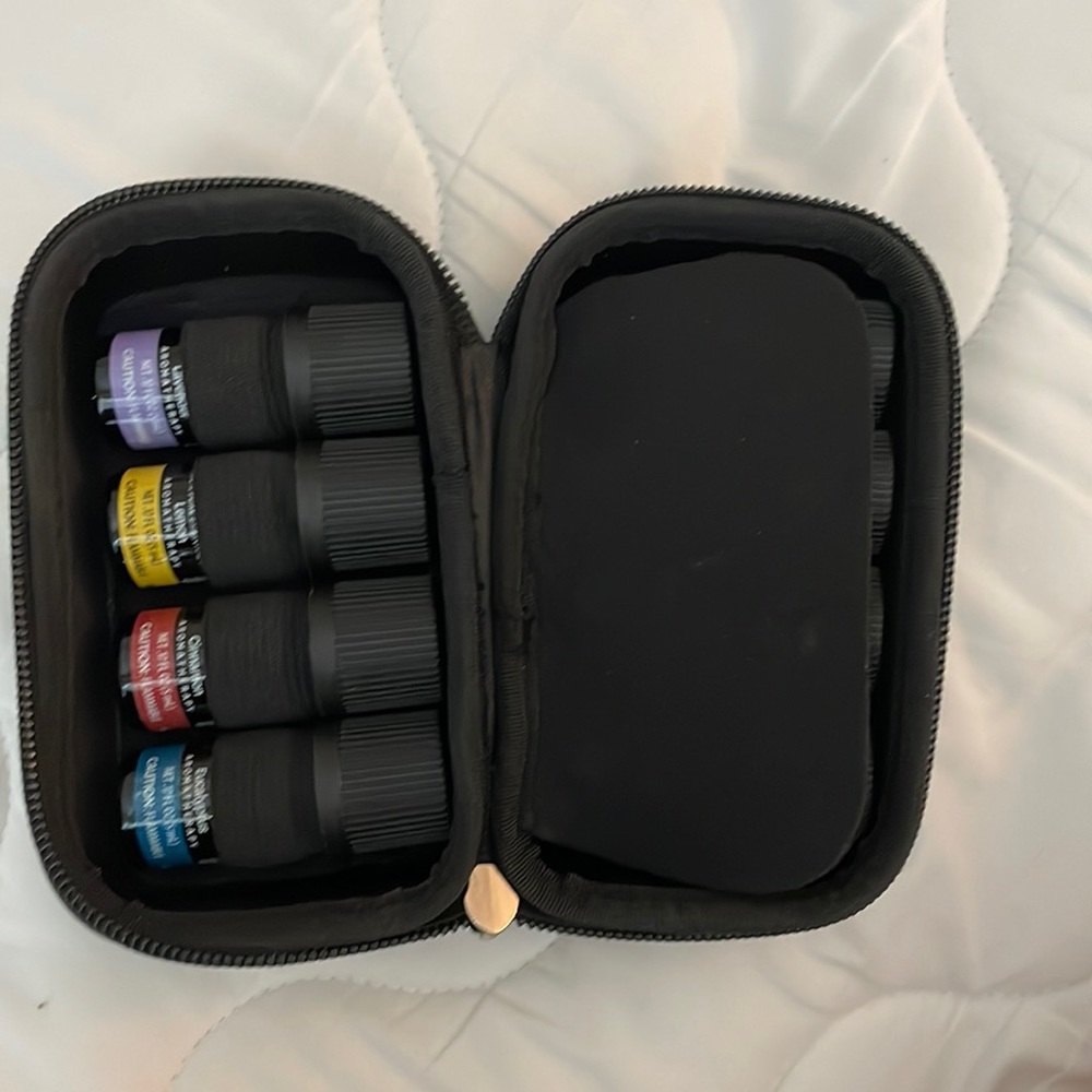 8 Essential oils. Black zip up case